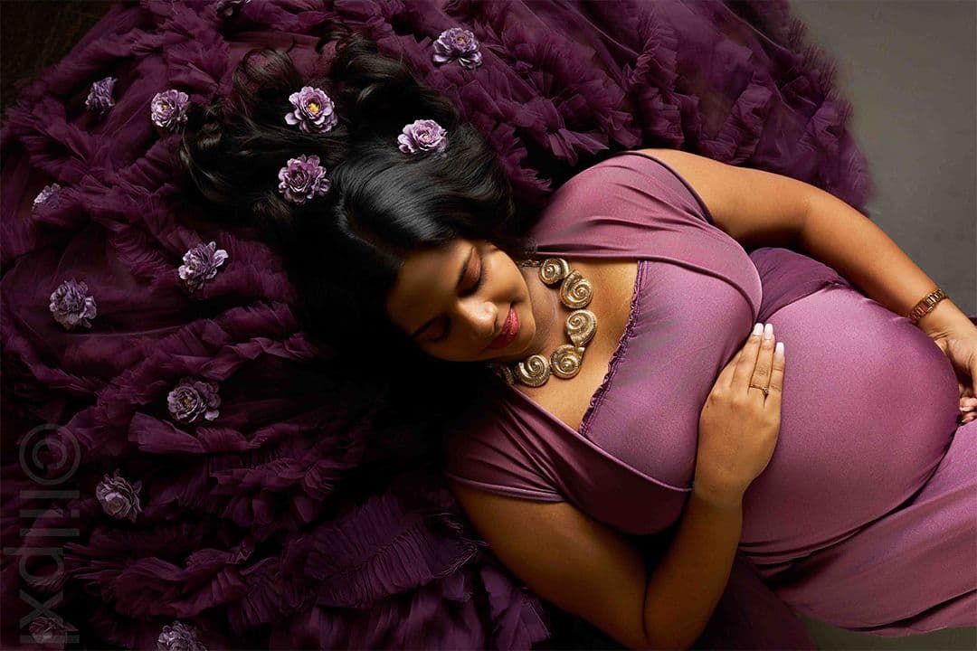 Overhead maternity portrait with flowers styled into flowing dark hair